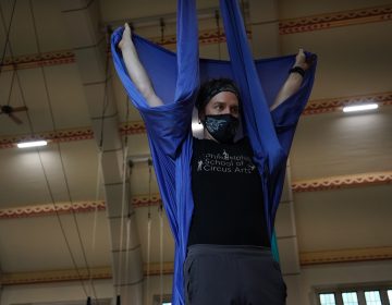 Adam Woolley instructing the class on the aerial swing. (Kenny Cooper/WHYY)