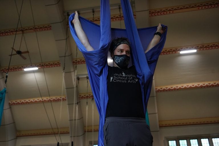 Adam Woolley instructing the class on the aerial swing. (Kenny Cooper/WHYY)