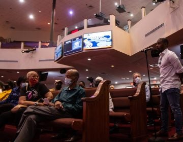 Walnut Hill resident Shuja Moore offered the idea of reaching out to Philadelphia’s biggest influencers to help combat the city’s gun violence epidemic at the Philadelphia District Attorney’s Office Community Town Hall at the Church of Christian Compassion in West Philadelphia. (Kimberly Paynter/WHYY)