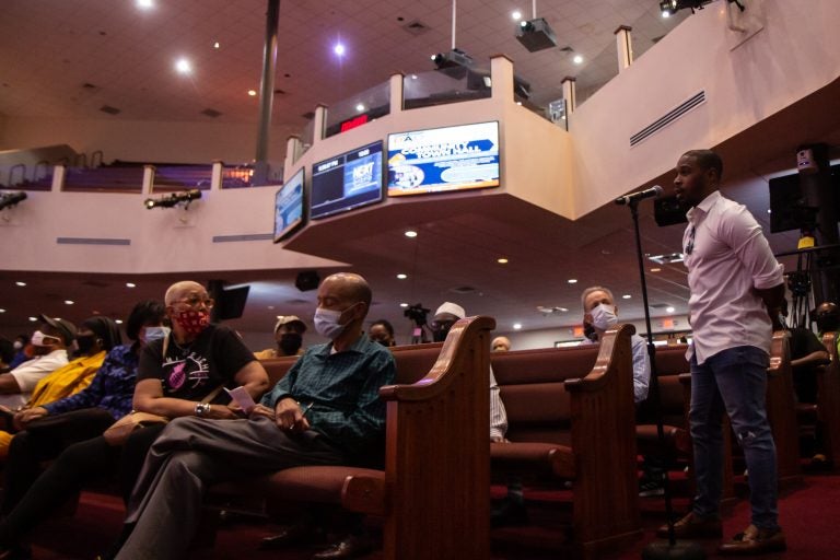 Walnut Hill resident Shuja Moore offered the idea of reaching out to Philadelphia’s biggest influencers to help combat the city’s gun violence epidemic at the Philadelphia District Attorney’s Office Community Town Hall at the Church of Christian Compassion in West Philadelphia. (Kimberly Paynter/WHYY)