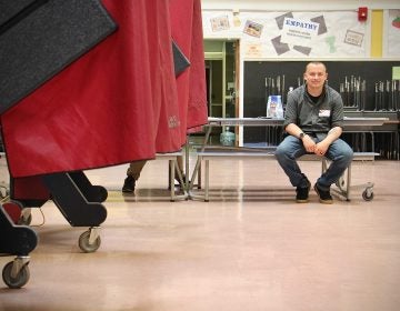 National Guardsman Tim Rzemyk helps out at a polling place