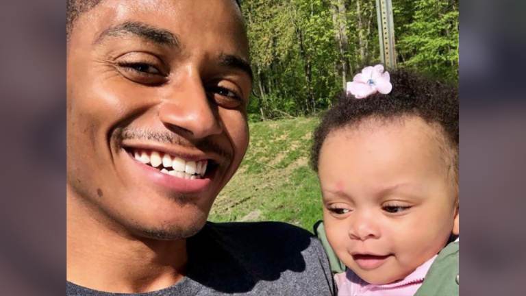 Marquise Dogan poses with his daughter Mylan. “We have to understand as parents, it’s all about our children,” he said. (Philadelphia Tribune)