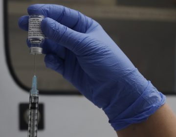 A vial of the Phase 3 Novavax coronavirus vaccine is seen ready for use