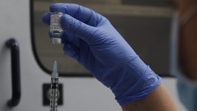 A vial of the Phase 3 Novavax coronavirus vaccine is seen ready for use