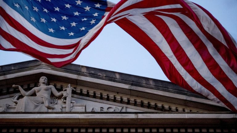 An American flag flies outside the Department of Justice