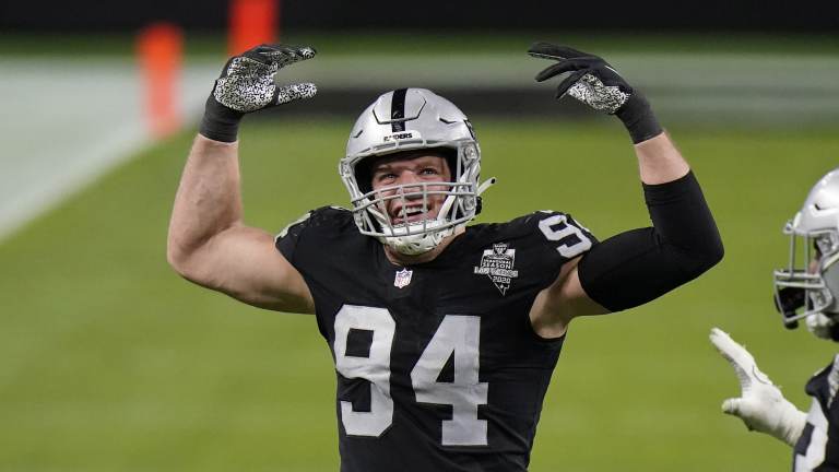 Carl Nassib celebrates during a football game