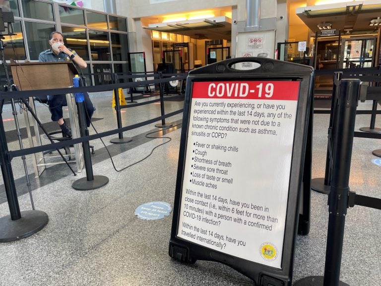 Anybody entering the courthouse in Wilmington must under screening for  COVID-19  symptoms. (Cris Barrish/WHYY) 