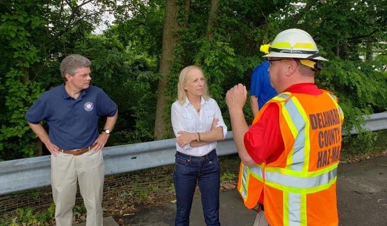 EMS and elected officials monitor the site of an oil spill in Delco