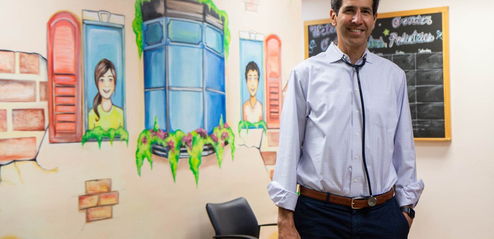 Dr. Eric Berger stands inside his Center City Pediatrics office