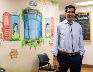 Dr. Eric Berger stands inside his Center City Pediatrics office