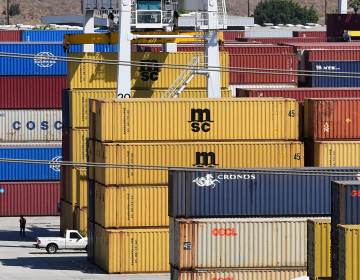 Shipping containers stacked high at the Port of Los Angeles