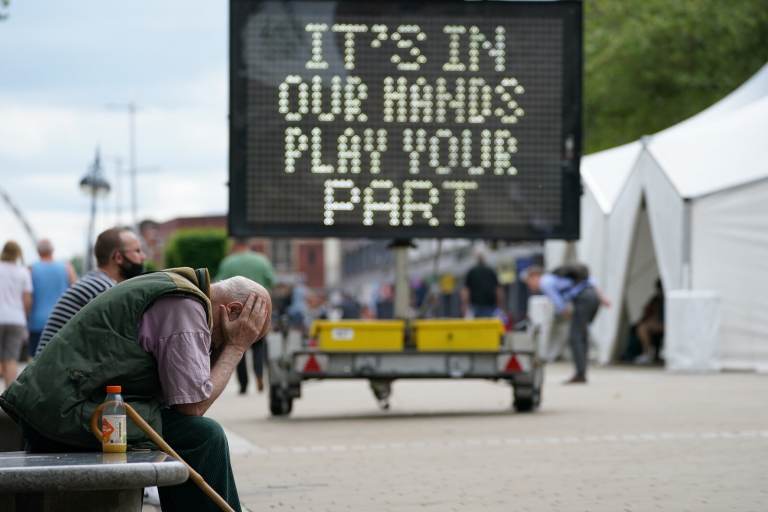 A sign outside a COVID-19 vaccination center reads, 