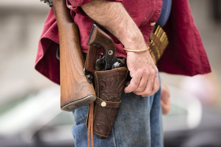 A closeup of a protester's open carry gun