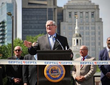 Philadelphia Mayor Jim Kenney speaks from behind a podium