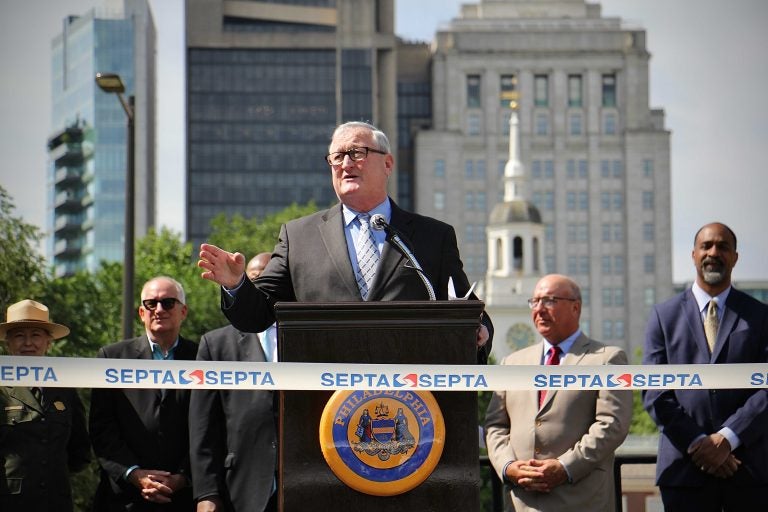 Philadelphia Mayor Jim Kenney speaks from behind a podium