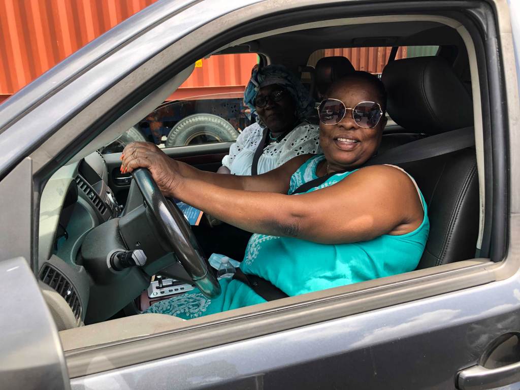 Nadette Perdriel (left) and her sister, Marie Claude Francois sit inside a car