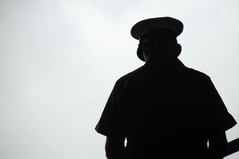 Silhouette of a United States Marine praying, photographed from behind. (John M. Chase/Getty Images)