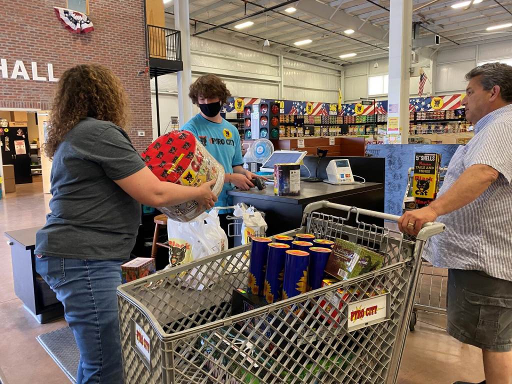 Donna Nuccio helps a customer at a Pyro City store