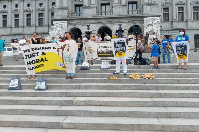 Members of the Poor People's Campaign in Pennsylvania gathered on the steps of the Capitol with signs calling for a 
