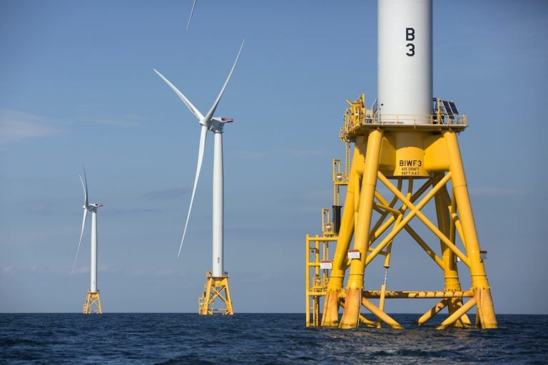 Three of Deepwater Wind's five turbines stand in the water off Block Island