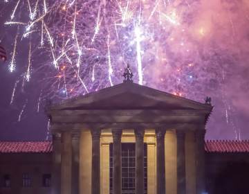Fireworks cascade behind the central portico of the Philadelphia Museum of Art. (Jonathan Wilson for WHYY)