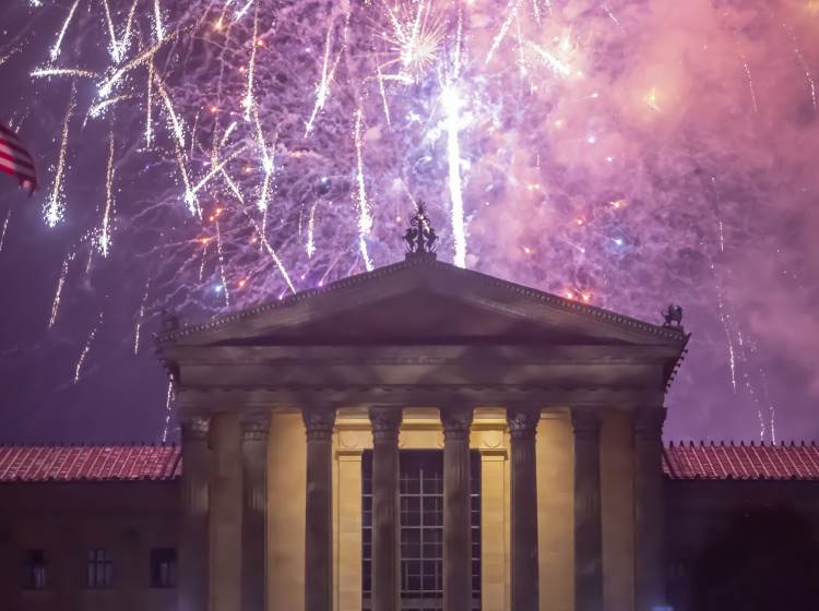 Fireworks cascade behind the central portico of the Philadelphia Museum of Art. (Jonathan Wilson for WHYY)