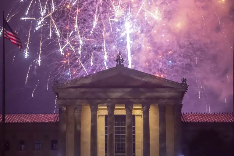 Fireworks cascade behind the central portico of the Philadelphia Museum of Art. (Jonathan Wilson for WHYY)