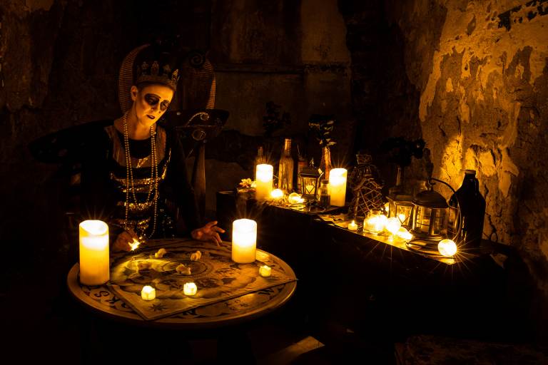 A fortune teller in The Speakeasy at Al Capone’s cell at Eastern State Penitentiary for its upcoming Halloween Nights festival. (Courtesy of ESP)