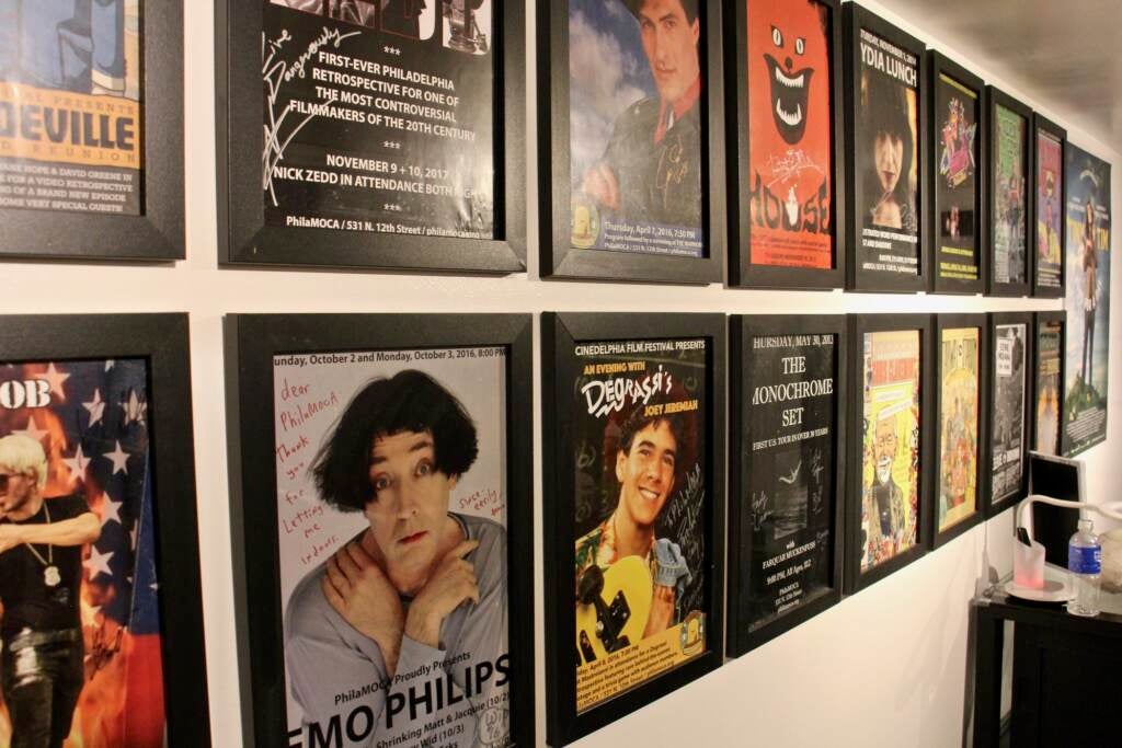 A closeup of posters on the wall