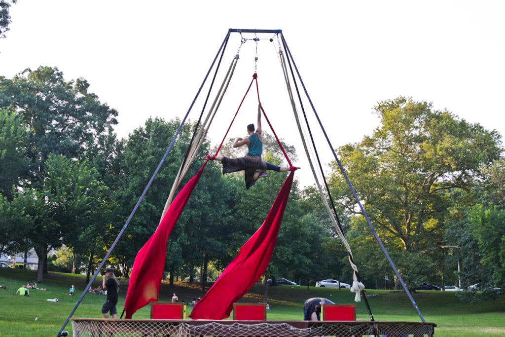 Kaitlin Chin performs aerials in a Shakespeare in Clark Park production