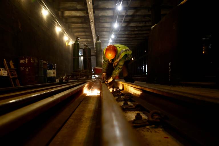 A file photo shows a SEPTA worker repairing a trolley track during a cleaning blitz. (SEPTA)