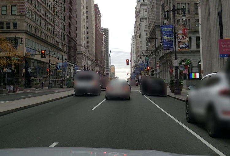 Photograph of South Broad Street taken by an automobile-mounted camera driving north toward City Hall. (The Chamber of Commerce Foundation)