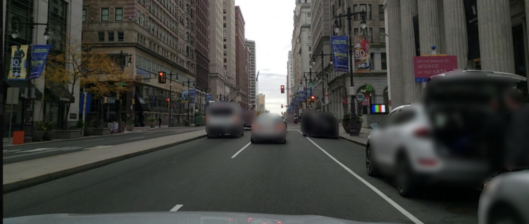 Photograph of South Broad Street taken by an automobile-mounted camera driving north toward City Hall. (The Chamber of Commerce Foundation)