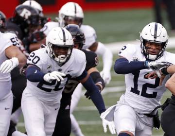 Penn State linebacker Brandon Smith (12) tackles Rutgers quarterback Johnny Langan (21) during the first half of an NCAA college football game Saturday, Dec. 5, 2020, in Piscataway, N.J. (Adam Hunger / AP Photo)