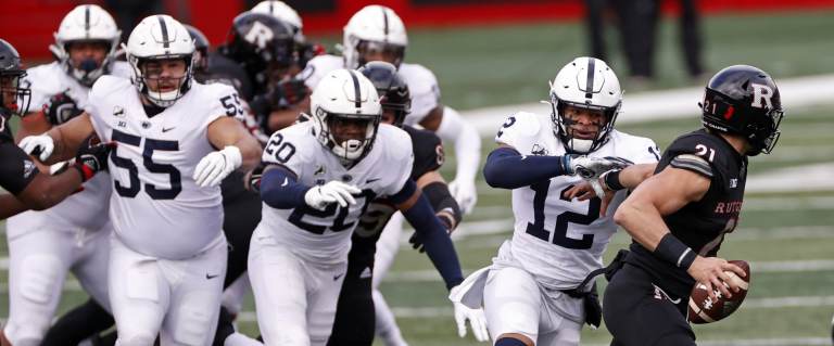 Penn State linebacker Brandon Smith (12) tackles Rutgers quarterback Johnny Langan (21) during the first half of an NCAA college football game Saturday, Dec. 5, 2020, in Piscataway, N.J. (Adam Hunger / AP Photo)