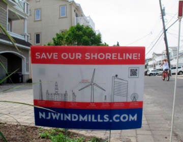 This July 8, 2021 photo shows a sign in Ocean City, N.J. urging opposition to offshore wind projects. (AP Photo/Wayne Parry)