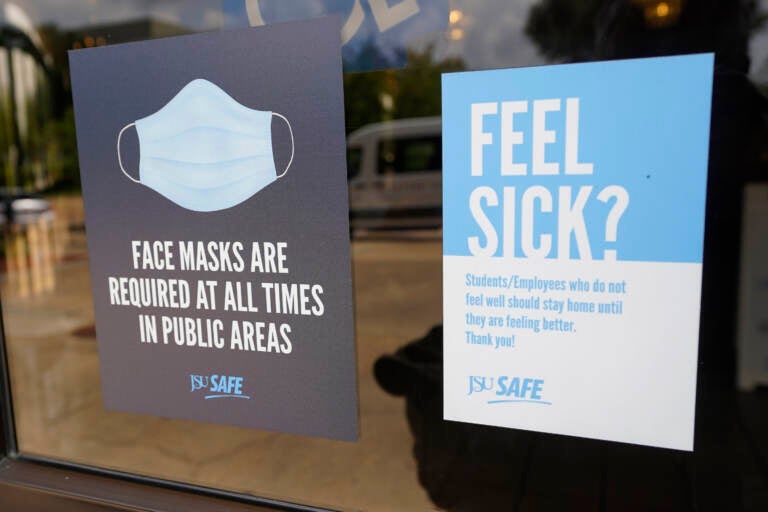 The CDC announced new recommendations that vaccinated people return to wearing masks indoors in parts of the U.S. where the coronavirus is surging.  (AP Photo/Rogelio V. Solis)
