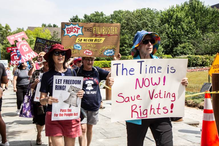 Voters in Philadelphia rallied in support of the For The People Act outside the National Constitution Center during a speech given by President Joe Biden. (Kimberly Paynter/WHYY)