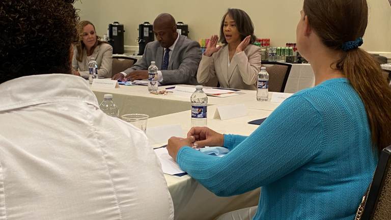 Delaware Congresswoman Lisa Blunt Rochester talks about plans for the future of I-95 in Wilmington during a round table community meeting Monday afternoon. (Mark Eichmann/WHYY)