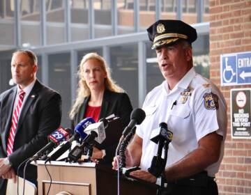 Philadelphia police Chief Inspector Frank Vanore (right) joins acting U.S. Attorney Jennifer Arbittier Williams and FBI Assistant Special Agent in Charge James Christie to announce federal murder-for-hire and weapons charges against Darnell Jackson, 47, of Philadelphia. (Emma Lee/WHYY)