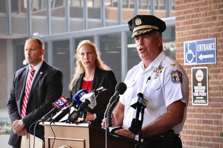 Philadelphia police Chief Inspector Frank Vanore (right) joins acting U.S. Attorney Jennifer Arbittier Williams and FBI Assistant Special Agent in Charge James Christie to announce federal murder-for-hire and weapons charges against Darnell Jackson, 47, of Philadelphia. (Emma Lee/WHYY)