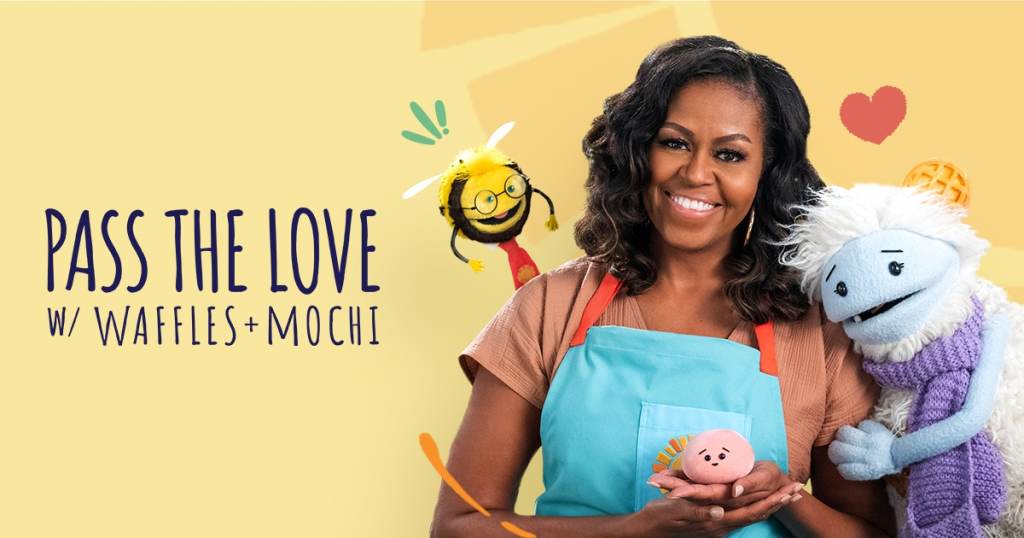 Michelle Obama is pictured with Waffles + Mochi in a promotional image for the 'Pass the Love' campaign