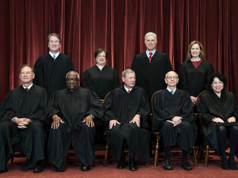 Members of the Supreme Court pose for a group photo at the Supreme Court in Washington
