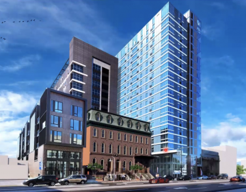 An artist's rendering shows the 13-story apartment tower Orens Brothers Real Estate plans to build