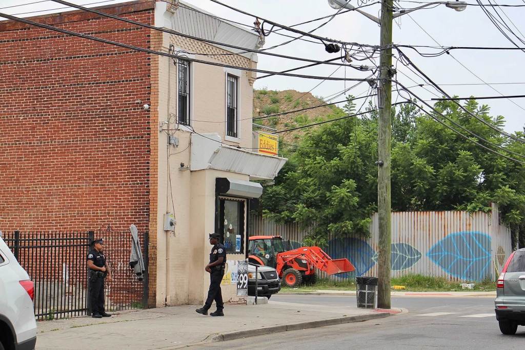 A huge mound of dirt and construction debris looms over the intersection on 7th and Chestnut streets.