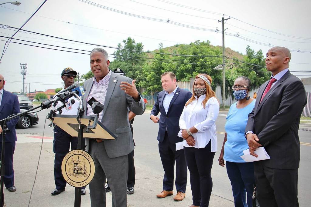 Camden Mayor Victor Carstarphen speaks from a podium in Camden