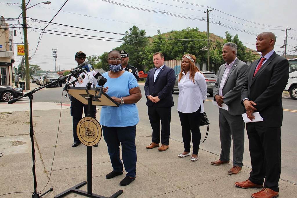 Shelia Roberts speaks from a podium in Camden