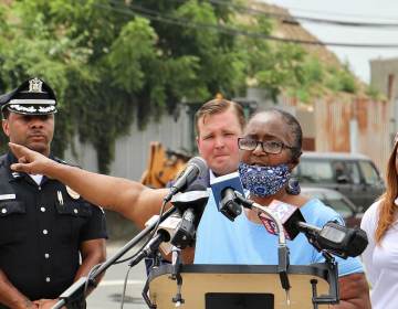 Shelia Roberts speaks from a podium in Camden