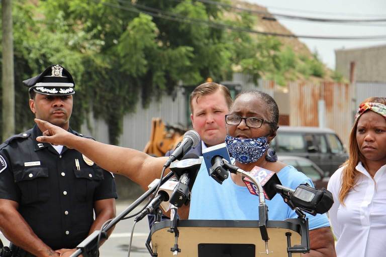 Shelia Roberts speaks from a podium in Camden