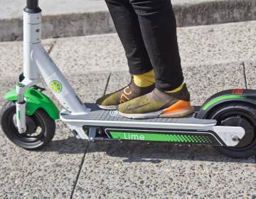 Riders were invited to test drive the Lime scooter at City Hall in Philadelphia. (Kimberly Paynter/WHYY)